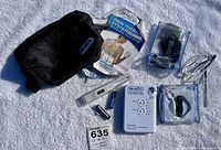 Overview of Dr Ho Plus Pulse Massager Model PT S-11 with all components laid out on white textured surface.