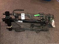 Full view of the Thule bike rack showing two horizontal bars with rubberized adjustable straps to hold bikes and vertical hitch mount post.