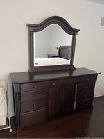 Full view of the dresser with mirror mounted on top, showcasing the overall look and design.