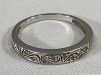 Front view showing filigree engraving on band
