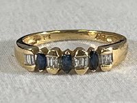 Front view showing alternating sapphires and diamonds