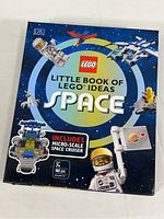 Front cover of LEGO Little Book of Space Ideas showing astronauts, spacecrafts, and branding.