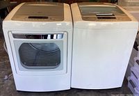 Wide shot of washer and dryer side by side, front view