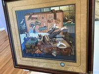 Framed cat print by Charles Wysocki showing cat on vintage suitcases and wall travel stickers