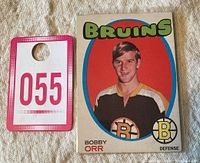 Front side of the 1971-72 O-Pee-Chee Bobby Orr #100 hockey card showing portrait, Bruins team name, logo, and player name with position.