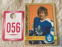 Another front view of the Darryl Sittler #188 OPC hockey card with a small numbered tag (056) placed beside it for lot identification.