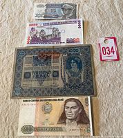 Overview of five world banknotes, including Peruvian and Austrian notes.
