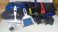 Full lot including inflatable head rests and blankets, squeegee, dustpan brush, phone holders, small lock