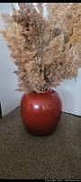 Front view of deep red ceramic vase with pampas grass for scale (pampas not included)