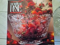 Photo of McCallion Rose 24% lead crystal glass bowl in its original box with floral etched design visible.