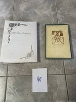 Full view of the Wedding Memories album and decorative box side by side on tiled floor.