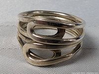 Top perspective of the vintage sterling silver ring showing multi-band design and oval cutouts.