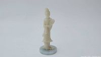 Full view of the Chinese woman jade figurine on green jade circular base