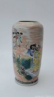Full view of Chinese porcelain vase showing hand painted traditional figures and outdoor garden scene on a pinkish background. Neck shortened.