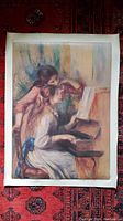 Full canvas showing the two young girls at the piano sitting indoors, focused on a sheet of music.