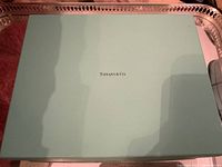 Top view of Tiffany & Co original blue box with brand name on center of lid