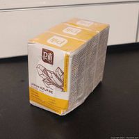 Three sealed soap bars of Pili sulfur soap in yellow and white packaging, showing the brand Pili and product features in Spanish and English.