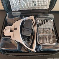 Packaged set showing magnifying glasses, carrying case, and 5 different lenses.