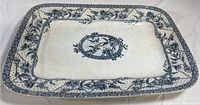 Top-down image showing the full rectangular platter with central floral medallion and decorative border pattern.