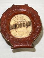 Top view of the wooden tray showing carved border and central map design of Michigan's Upper and Lower Peninsulas.
