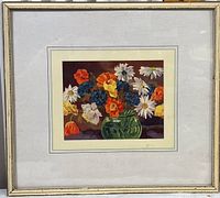 Full view of framed floral print in a silver-toned frame with beige matting.