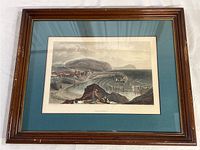 Full view of vintage Watchet print framed in wood with teal mat.