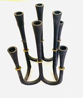 angled view showing eight candle sockets and brass ring details