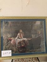 Framed vintage print of a woman sitting on a boat on a lake surrounded by natural scenery, titled "Lady on the Lake"