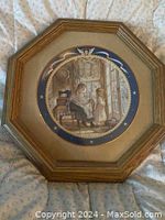 Framed collector plate titled Patient Angel by Trisha Romance, showing front image of a woman and child near a window in soft nostalgic colors, in octagonal gold-toned wooden frame.