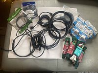 Overview of all cords and adapters showing various cables including HDMI extension cables, Globe power extension cords, AC to USB adapters, and a USB to Type-C adapter.