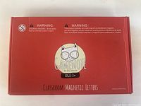 Closed red box labeled Gamenote Classroom Magnetic Letters for age 3+ with cat logo and warning labels.