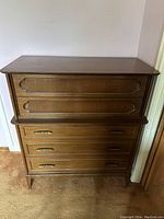 Full view of the darkwood dresser showing drawers and overall condition.