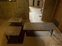Overview of the two Mid-Century Modern coffee tables in a room showing their size comparison and wood finish.
