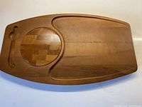 Full view of solid maple Baribocraft cheeseboard with removable round cutting board and indentation for crackers and cheese.