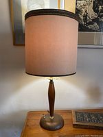 Full view of the lamp lit showing shade and overall shape