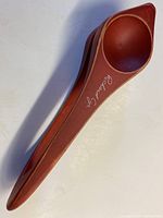 Wooden spoon with signature 'Richard Cyr' on handle, showing overall shape and finish.