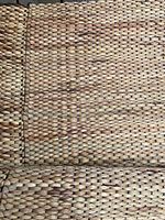 Close-up view of the carpet’s edge showing the seam and braided woven texture.