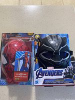 Photo of two Marvel masks new in packaging: Black Panther and Spider-Man masks