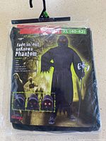 Front packaging showing the costume image with glowing red eyes and all costume elements.