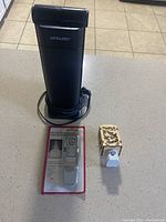 OTT-Lite quilting light, book light in package, and night light with bulb all visible