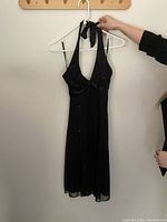 Black halter dress with sequin details