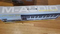 Original packaging box for M-Audio Keystudio 49 keyboard controller, showing product branding and image.