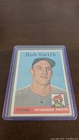 Front side of the 1958 Topps Bob Smith rookie card featuring the player's portrait and team information.