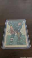 Front of 1953-54 Parkhurst Don "Bones" Raleigh hockey card #68 in protective sleeve.