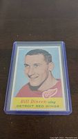 Front of the 1957-58 Topps Bill Dineen hockey card showing the player portrait and team information.