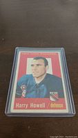 Front of 1959-60 Topps Harry Howell hockey card showing player image and details.