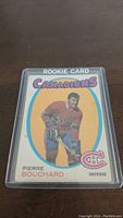 Front of 1971-72 OPC Pierre Bouchard Rookie Card in plastic sleeve