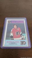 Front view of 1975-76 Topps Bobby Clarke hockey card #286 in protective sleeve.