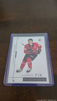 Front of the Connor Bedard rookie hockey card in protective case showing player image, name, team, and Rookie FIX branding.