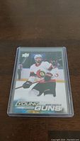 Front of Mark Kastelic Young Guns Rookie hockey card showing player in action on ice, branded by Upper Deck.